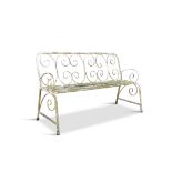 A WROUGHT IRON GARDEN SEAT, with tubular seat and scroll back. 155cm wide