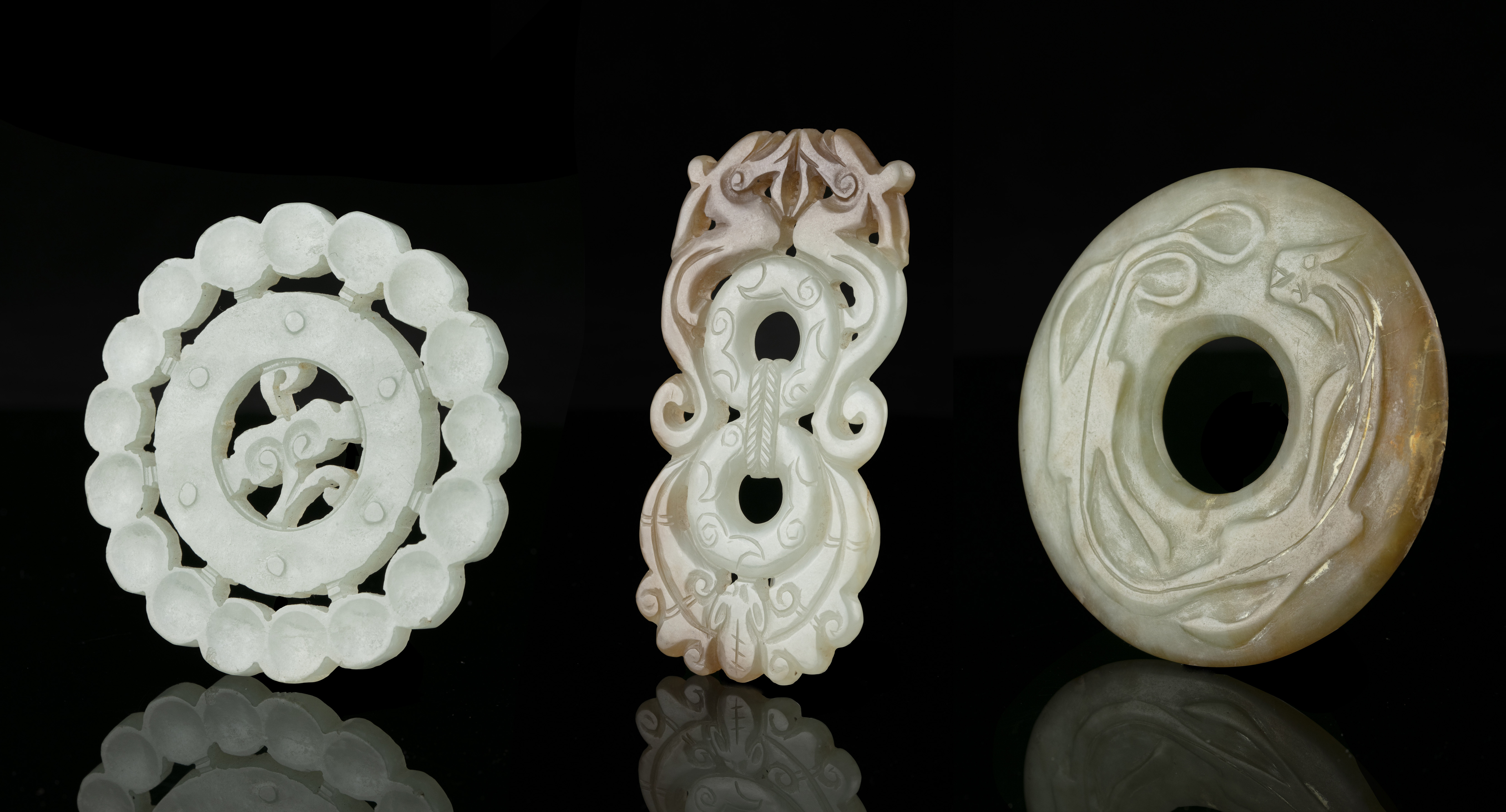 A GROUP OF THREE (3) JADE CARVINGS China The first one is an open-worked 'ruyi' plaque. The second