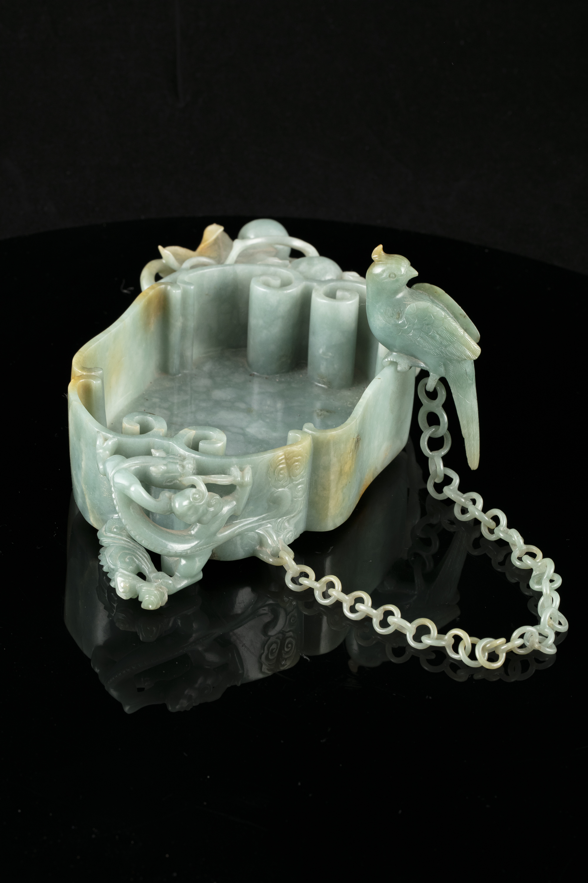 A LINGZHI-SHAPED JADEITE JADE BRUSHWASHER WITH A PARROT China, Qing Dynasty, 19th century