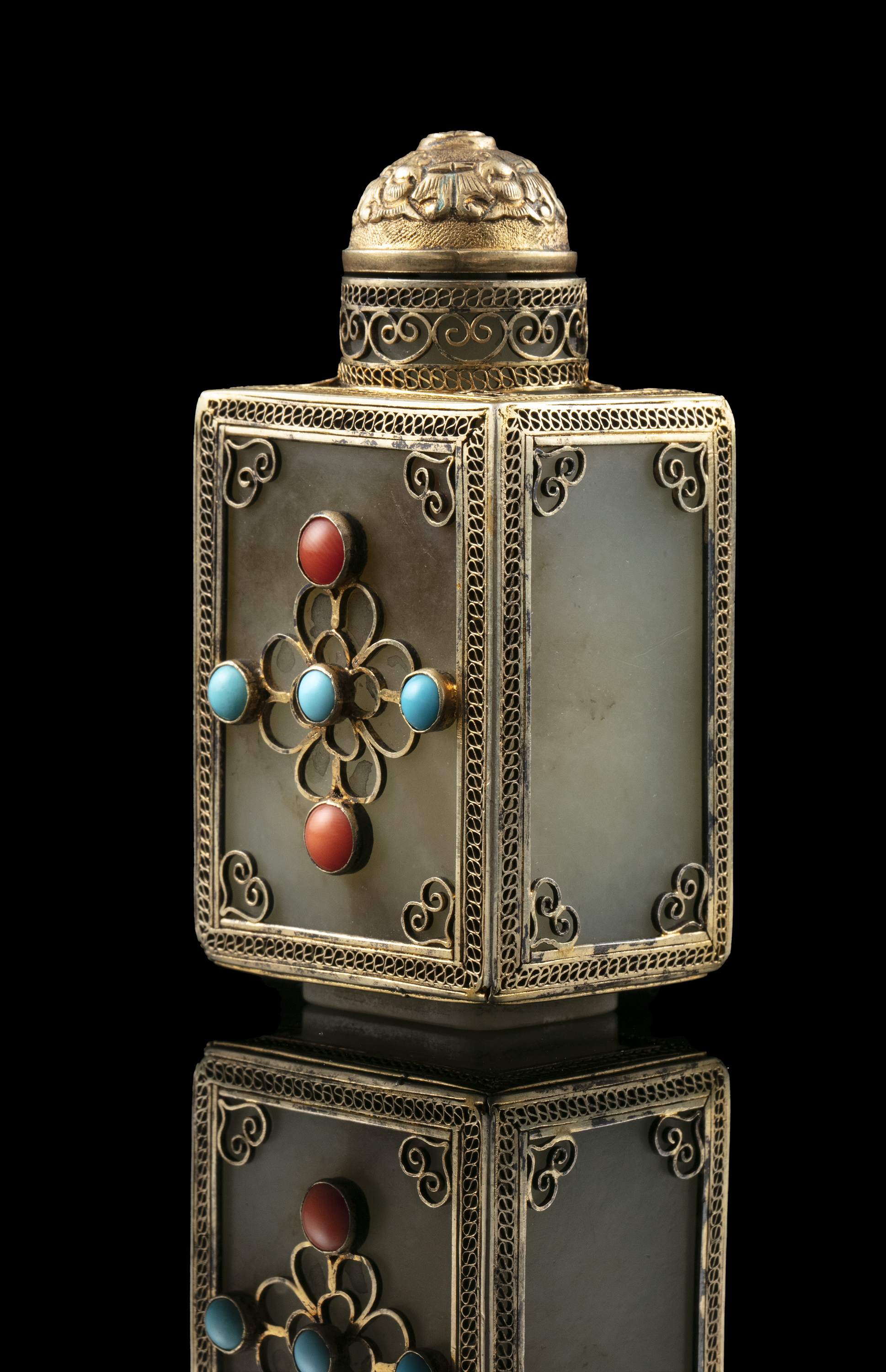 A SQUARE JADE SNUFF BOTTLE WITH MATCHING STOPPER China or Tibet, Circa 1900 Embellished with a