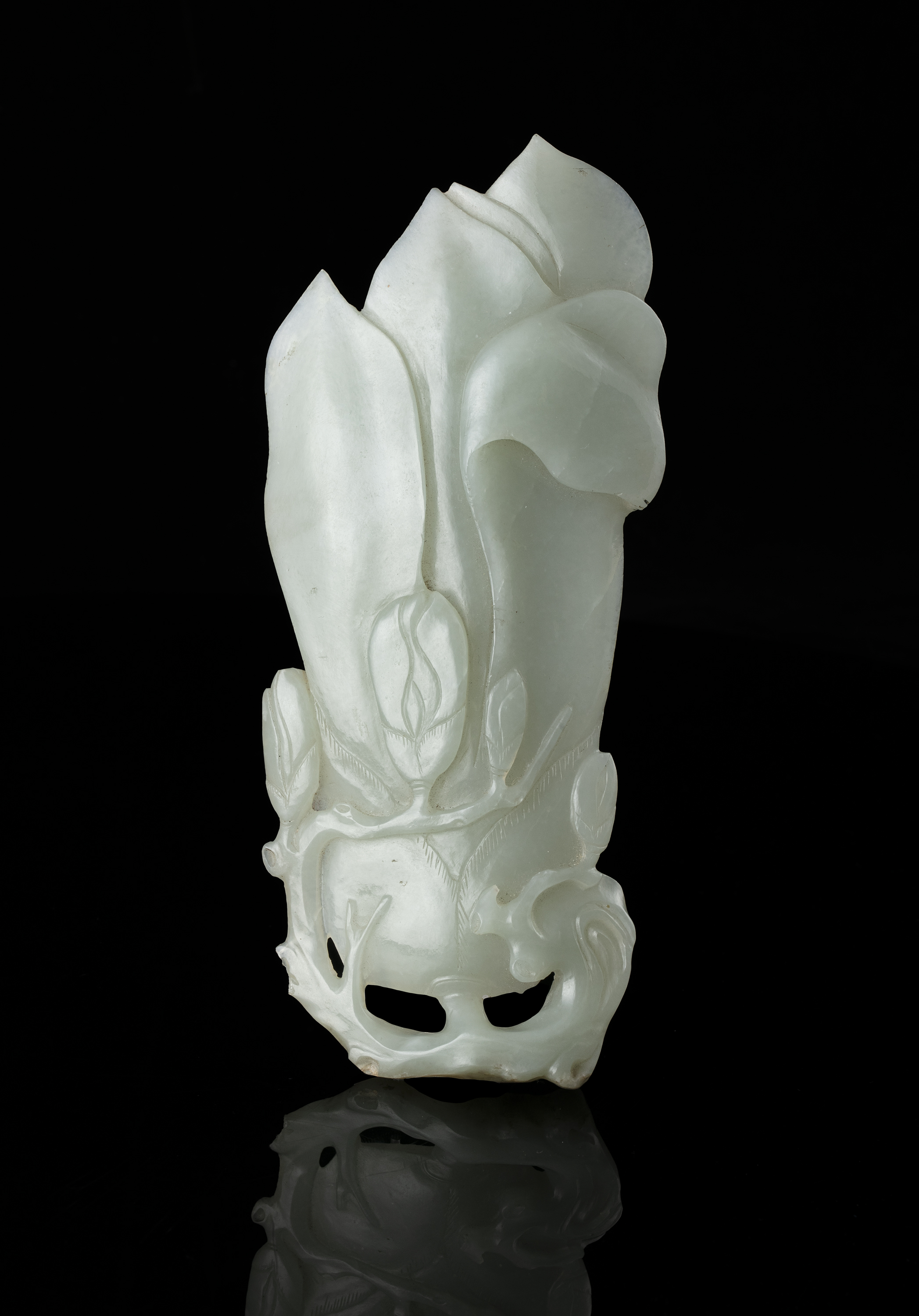 A PALE CELADON 'MAGNOLIA' JADE PLAQUE China, Qing Dynasty H: 16 cm - w: 7cm Weight: 161 grams