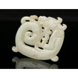 A PALE CELADON JADE 'COILED KUI DRAGON' PLAQUE/PENDANT China L: 6 cm - w: 4,8 cm Weight: 26 grams
