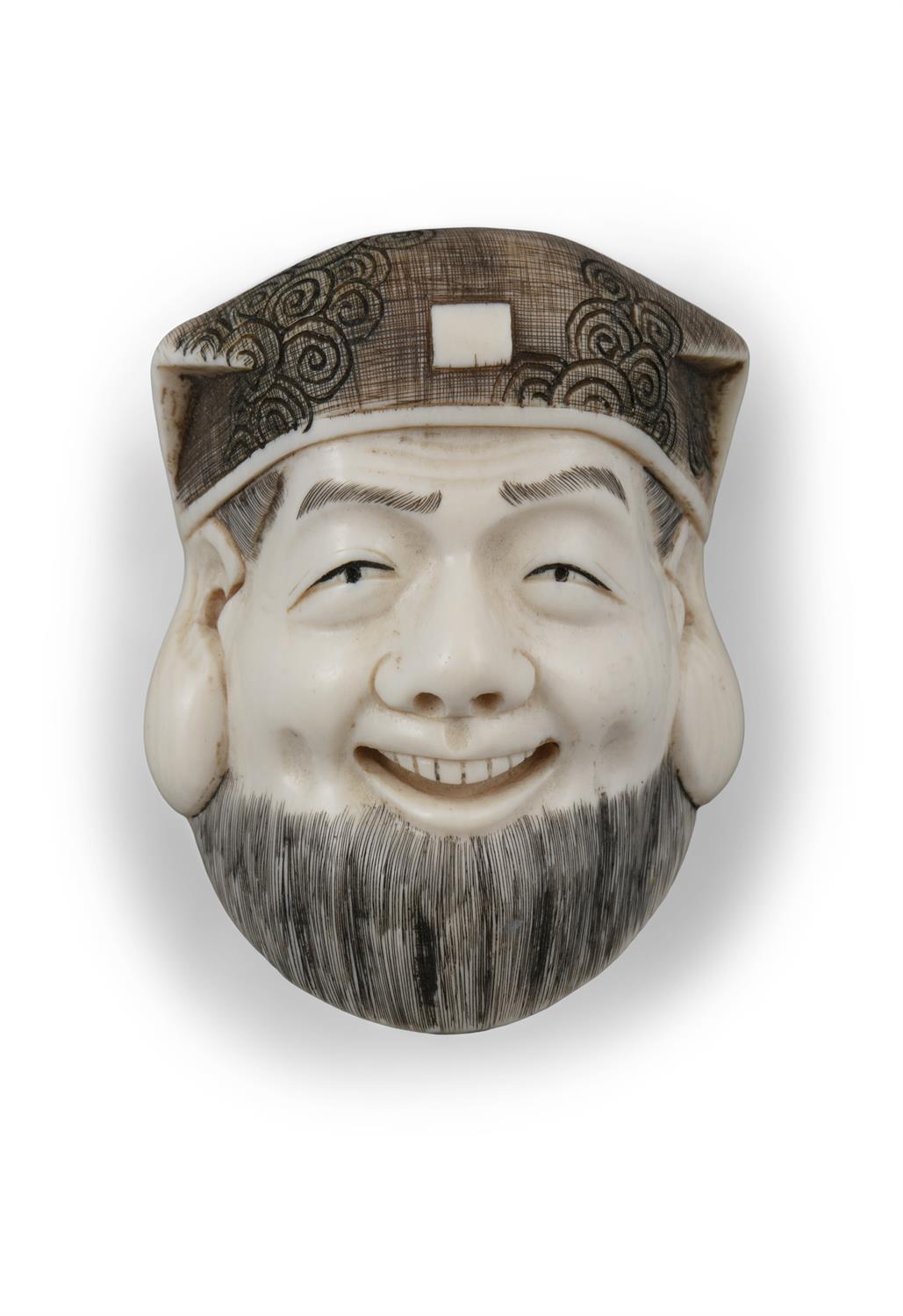 *A SIGNED IVORY 'FACE' KATABORI NETSUKE Japan, Meiji to Taisho period With a signature, - Image 3 of 4