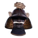 .A SAMURAI HELMET TOGETHER WITH A MASK, KABUTO AND MEMPO Japan, Edo period, 18th century Description