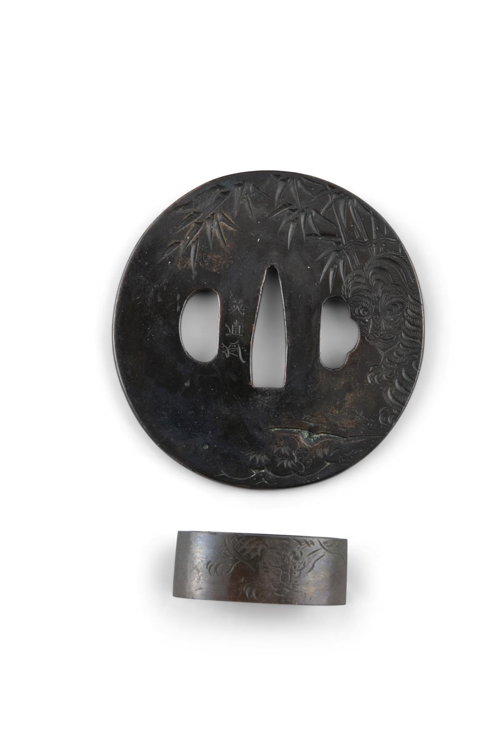 A NAGA MARU GATA TSUBA WITH SIGNATURE Japan, Edo period Wrought copper with shakudo finish, - Image 2 of 2