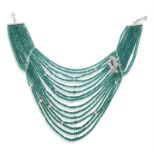 AN EMERALD AND DIAMOND NECKLACE, BY PEDERZANI Composed of fifteen rows of faceted emerald beads