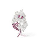 A DIAMOND AND RUBY BROOCH, CIRCA 1950 Designed as a stylised flower, the petals set with