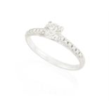 A DIAMOND SINGLE-STONE RING The brilliant-cut diamond weighing approximately 0.