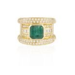 AN EMERALD AND DIAMOND RING The central cut-cornered square-cut emerald between borders pavé-set