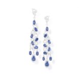 A PAIR OF SAPPHIRE AND DIAMOND PENDENT EARRINGS Of openwork scrolling design, set with oval and