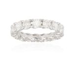 A DIAMOND ETERNITY RING Composed of a continuous row of brilliant-cut diamonds within a