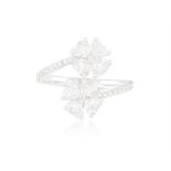 A DIAMOND FLOWER RING Composed of two flowerheads set with heart-shaped diamond petals centring