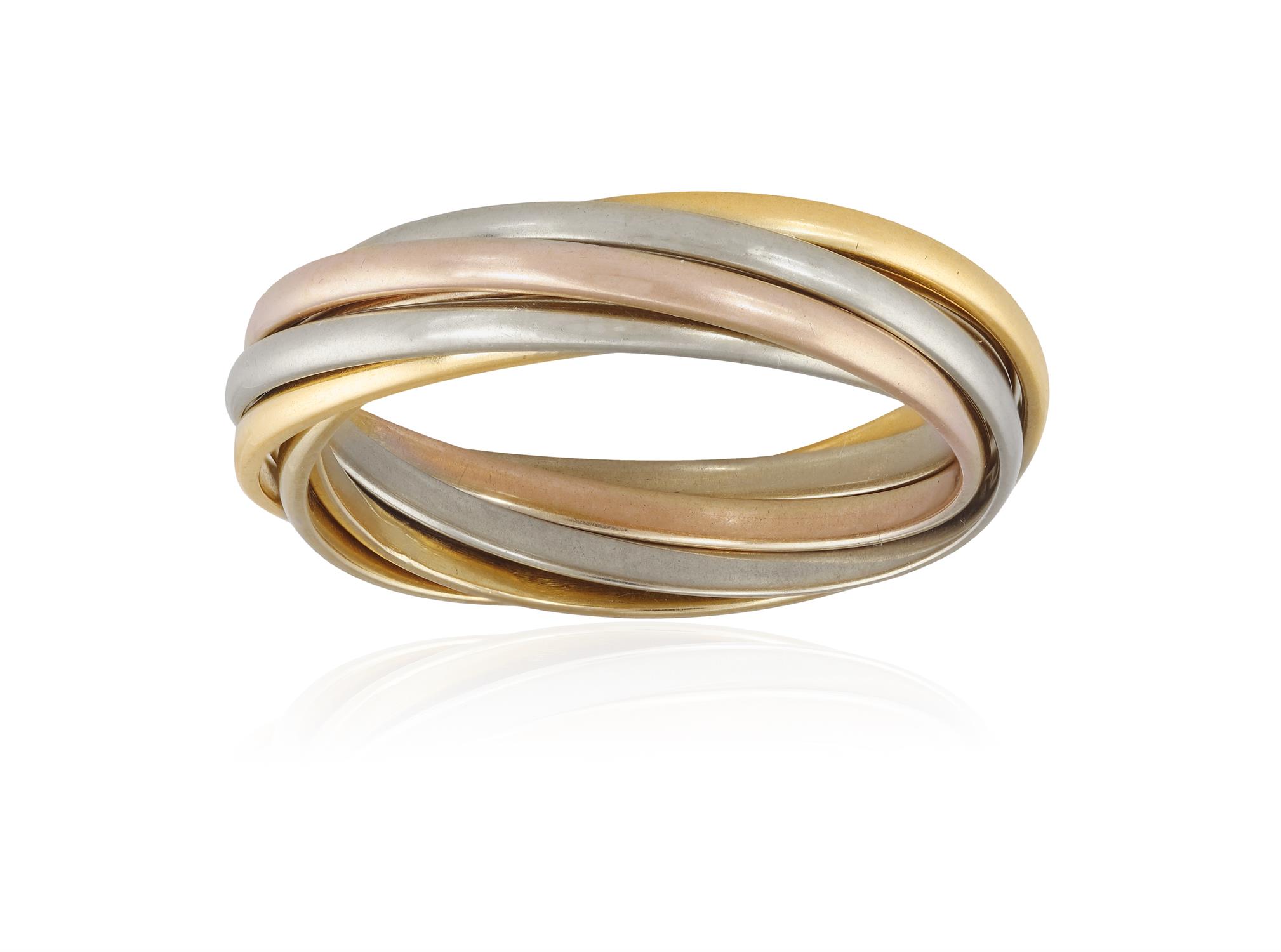 A TRI-COLOURED 'TRINITY' GOLD RING, BY CARTIER Composed of seven interlocking hoops of rose,