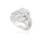 A DIAMOND RING, BY BOUCHERON, CIRCA 1990 The frontispiece pavé-set with brilliant-cut diamonds,