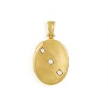 A DIAMOND AND GOLD PENDANT LOCKET The ovals-shaped pendant highlighted with three old