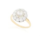 A NATURAL PEARL AND DIAMOND DRESS RING Composed of a central button-shaped natural pearl of