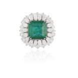 AN IMPORTANT EMERALD AND DIAMOND DRESS RING The central cut-cornered step-cut emerald weighing