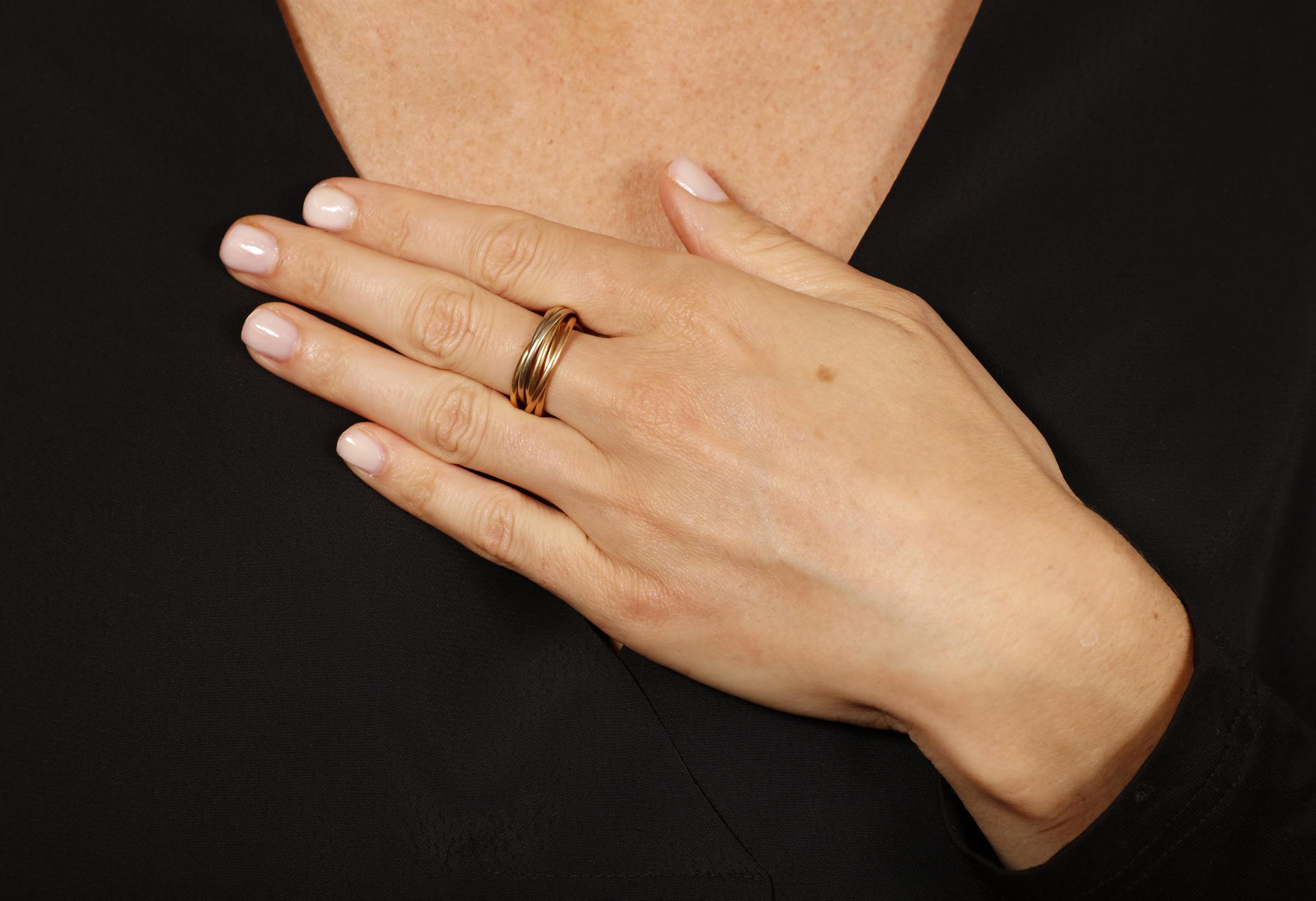 A TRI-COLOURED 'TRINITY' GOLD RING, BY CARTIER Composed of seven interlocking hoops of rose, - Image 3 of 3