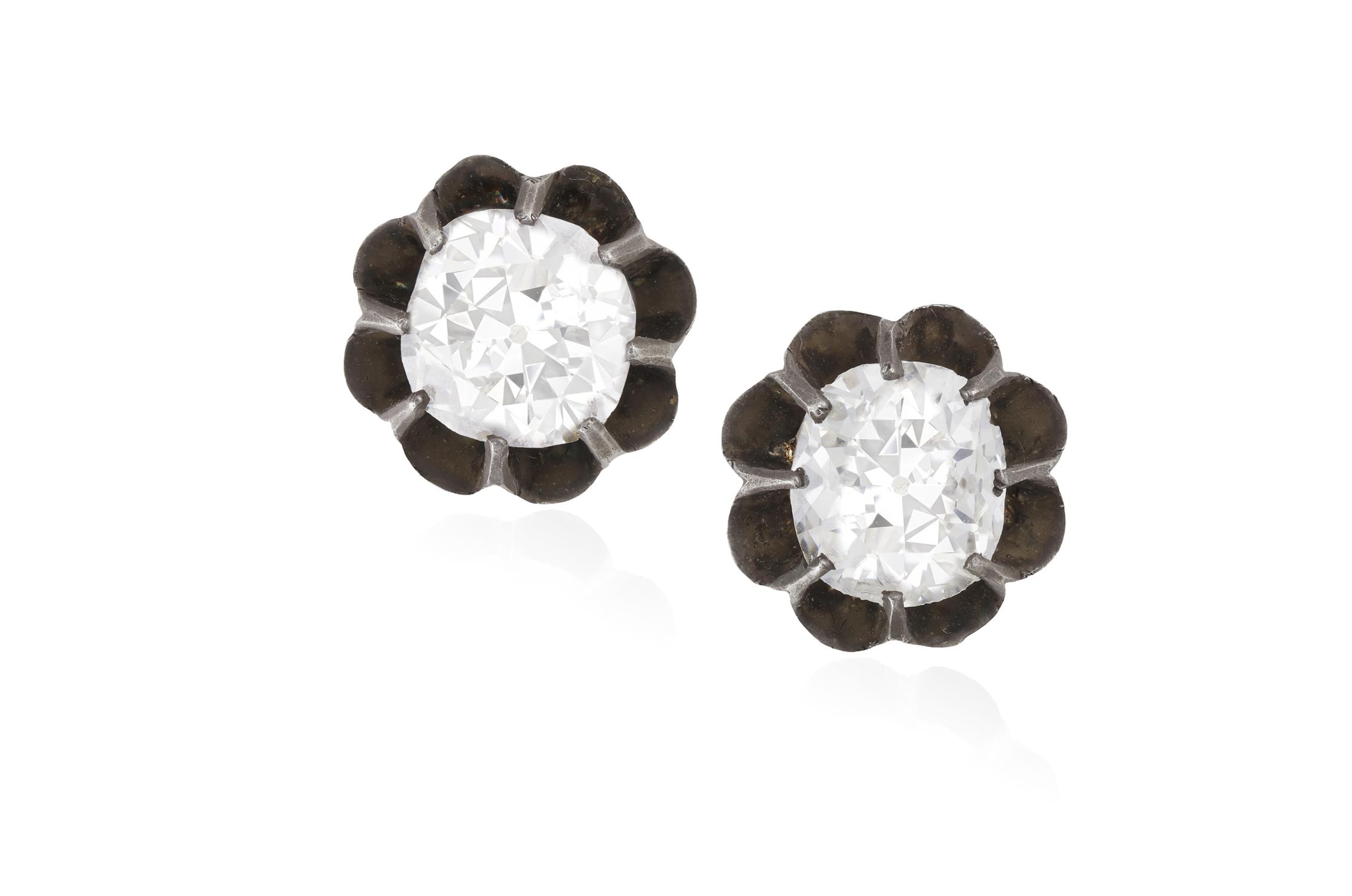 A PAIR OF 19TH CENTURY EARSTUDS, CIRCA 1890 Each old cushion-shaped diamond within multiple