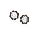 A PAIR OF 19TH CENTURY EARSTUDS, CIRCA 1890 Each old cushion-shaped diamond within multiple