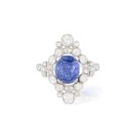 AN EARLY 20TH CENTURY SAPPHIRE AND DIAMOND DRESS RING The cushion-shaped sapphire within a