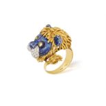 AN ENAMEL AND DIAMOND COCKTAIL RING Designed as a lion, applied with blue enamel,