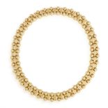 A GOLD COLLAR NECKLACE, BY BOUCHERON The continuous line of reeded X-links between borders of