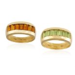 TWO GEM-SET RINGS, BY FRED PARIS Each frontispiece set with a row of rectangular-cut peridots or