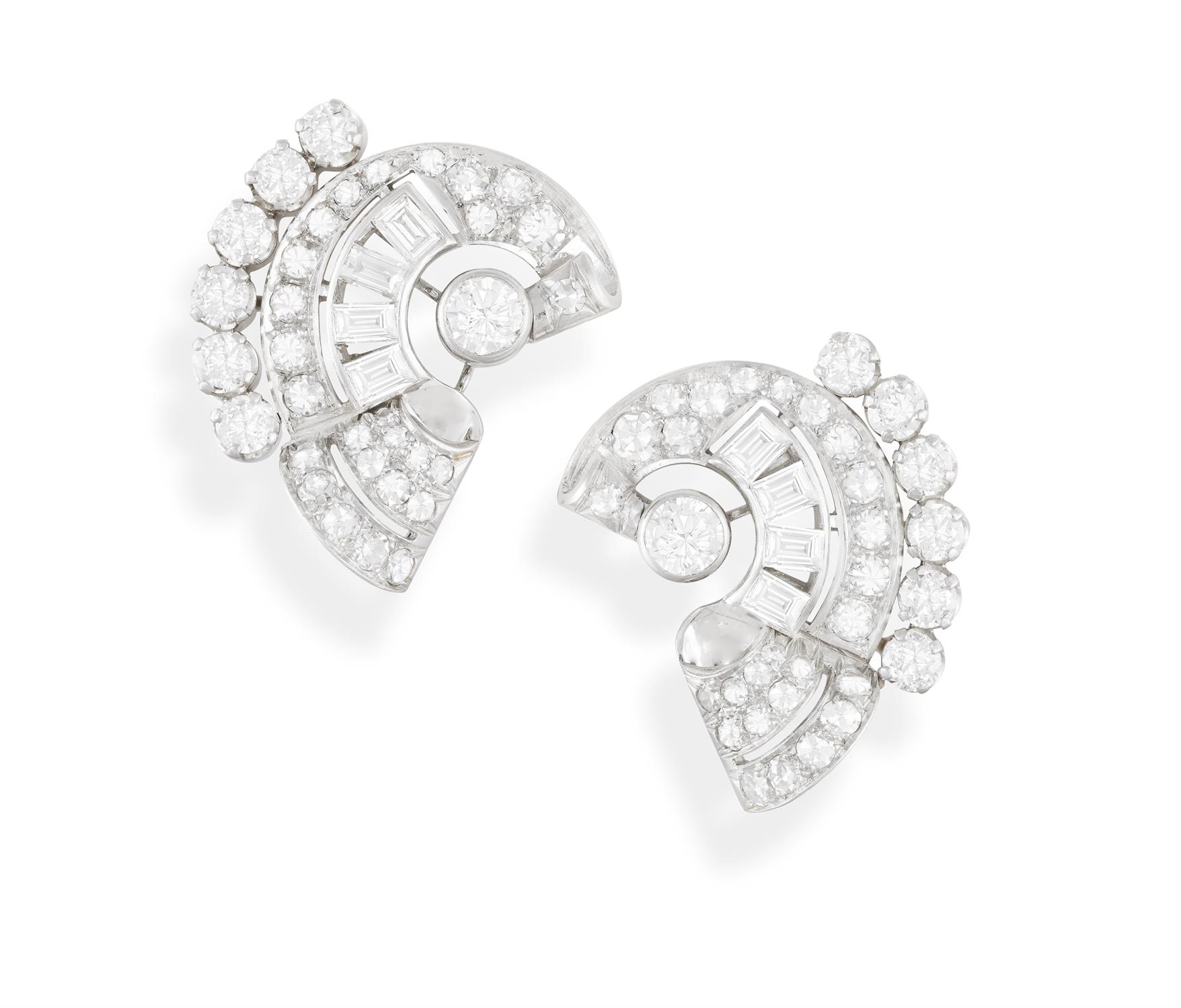 A PAIR OF DIAMOND EARCLIPS, CIRCA 1950 Of scrolling design, set throughout with European,