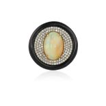 AN OPAL, ONYX AND DIAMOND COCKTAIL RING The central oval-shaped cabochon oval within a surround