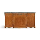 A SATINWOOD GILTMETAL AND MARBLE TOPPED SIDE CABINET, of breakfront outline, the shaped mottled