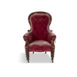 A VICTORIAN MAHOGANY AND BUTTON BACK UPHOLSTERED GENTLEMAN'S ARMCHAIR, covered in a claret velvet,
