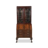 A GEORGIAN STYLE MAHOGANY BUREAU BOOKCASE, the top with twin astragal glazed doors above a