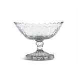 AN IRISH GEORGE III FLATCUT PEDESTAL BOWL, c. 1790, of oval shape with wavy rim above a band of