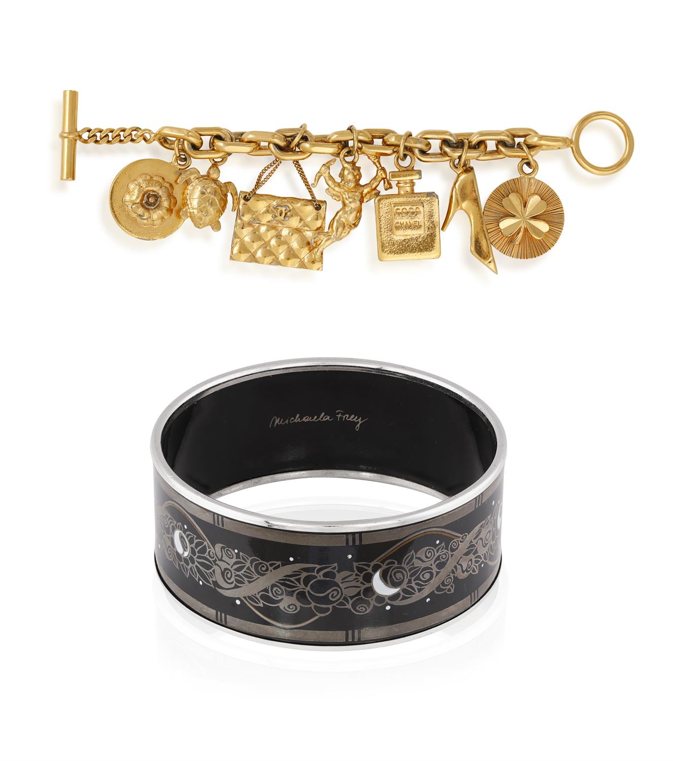 A GOLD COLOUR COSTUME CHARM BRACELET BY CHANEL, WITH A BANGLE BY FREY, the fancy-link large chain