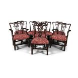 A SET OF EIGHT GEORGE III MAHOGANY FRAMED DINING CHAIRS, in the Chippendale taste, 19th century,