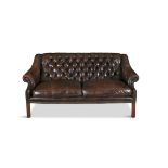 A 19TH CENTURY BROWN LEATHER CHESTERFIELD SETTEE, with square button back and downswept armrests,