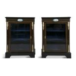 A PAIR OF 19TH CENTURY BRASS MOUNTED EBONISED CABINETS, of rectangular form, the tops with moulded