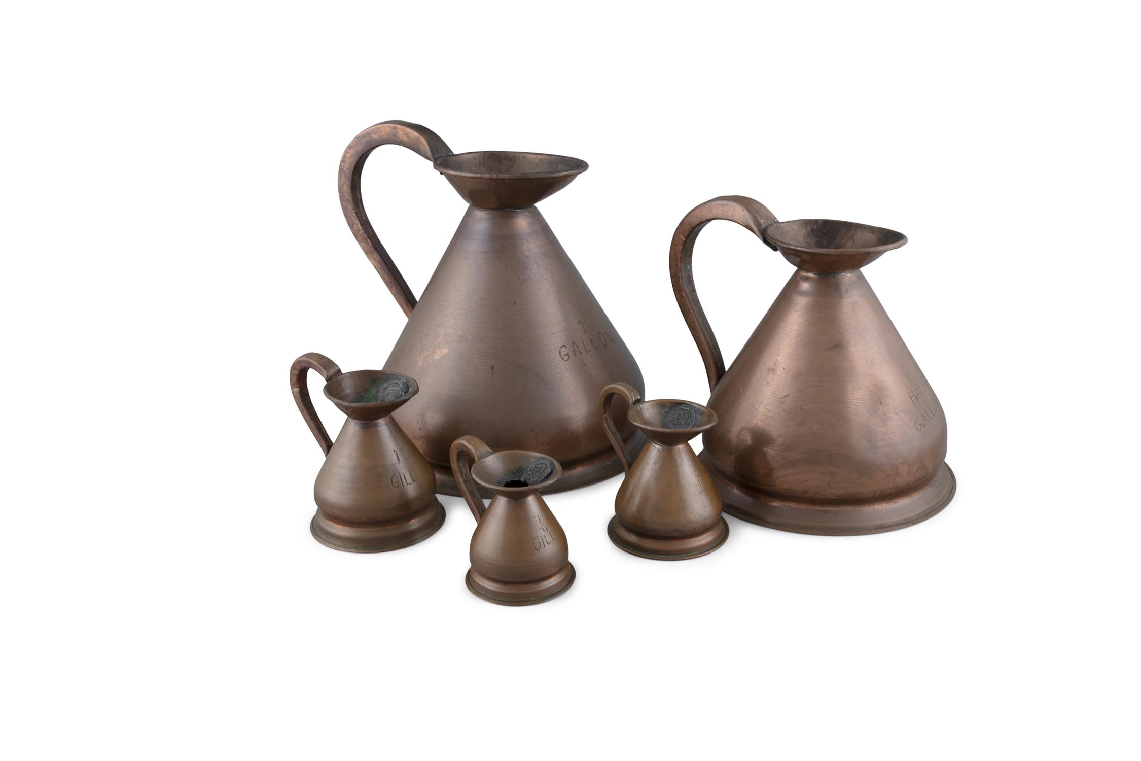 A SET OF FIVE 19TH CENTURY COPPER HAYSTACK MEASURES, of varying sizes, each applied with scroll