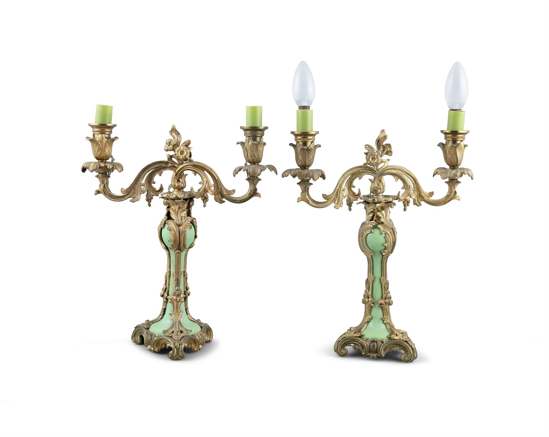 A PAIR OF GILTMETAL AND PORCELAIN CANDELABRA, with twin scroll arm branches, each with raised