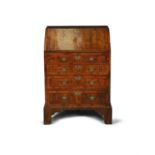 A GEORGE II STYLE INLAID WALNUT FALL FRONT BUREAU, of compact proportions, the slope writing