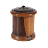 A LIGNUM VITAE TREEN CANISTER AND COVER, with stepped circular cover