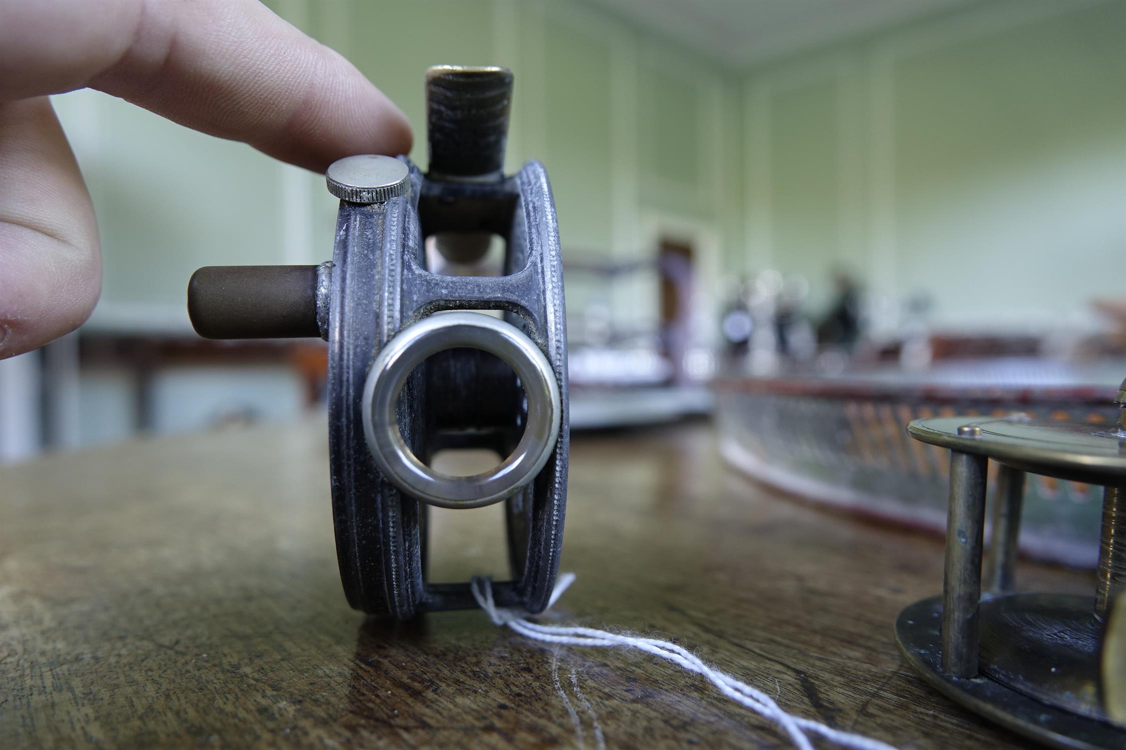 A COLLECTION OF FISHING AND ANGLING RELATED ITEMS, comprising: a Hardy 'Perfect Fly Reel' size - Image 8 of 20