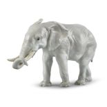 A CONTINENTAL PORCELAIN MODEL OF AN ELEPHANT. 21cm high
