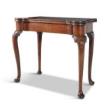 AN IRISH GEORGE III MAHOGANY FOLD TOP CARD TABLE, the rectangular top with rounded fore corners,