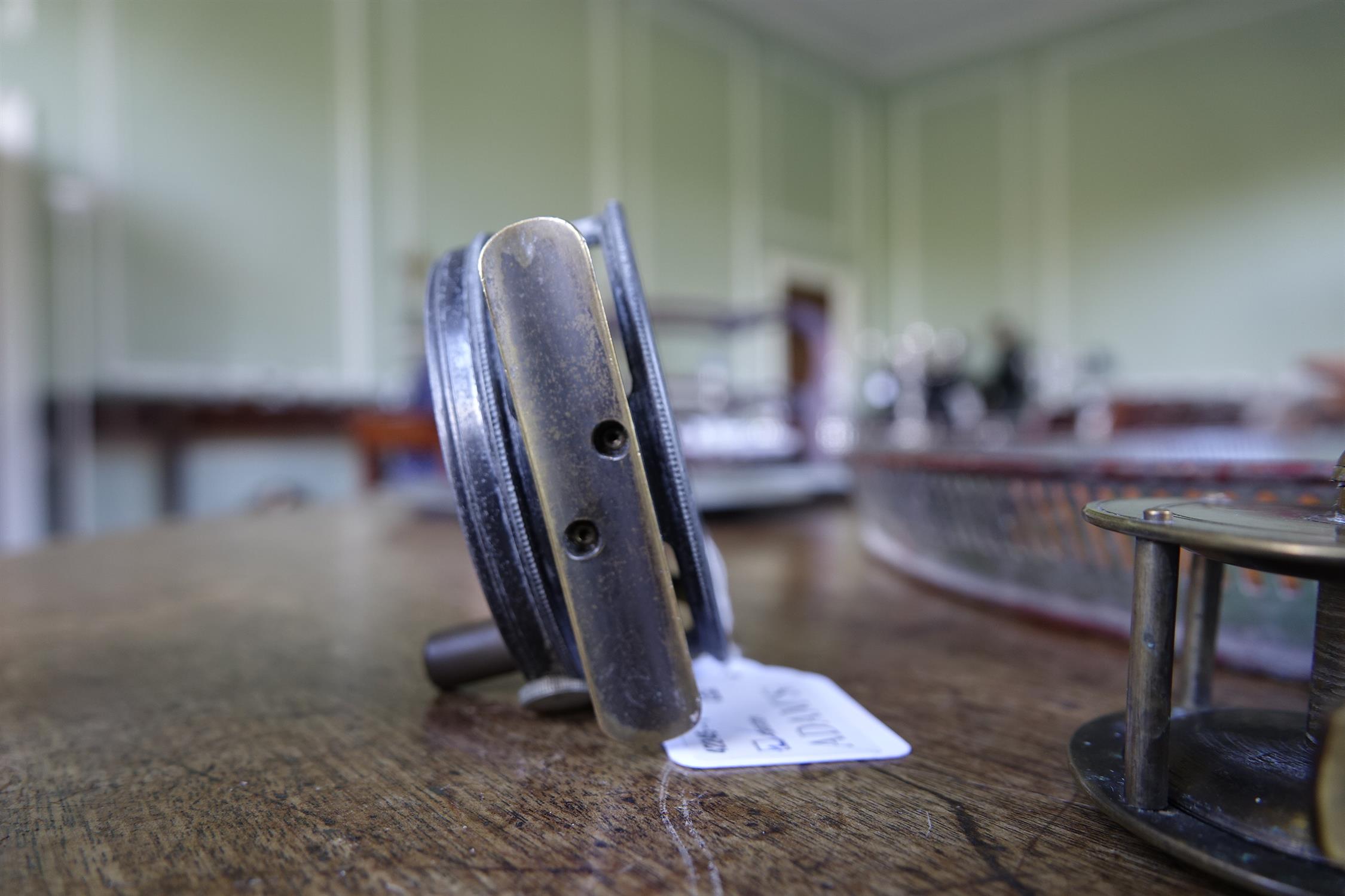 A COLLECTION OF FISHING AND ANGLING RELATED ITEMS, comprising: a Hardy 'Perfect Fly Reel' size - Image 9 of 20