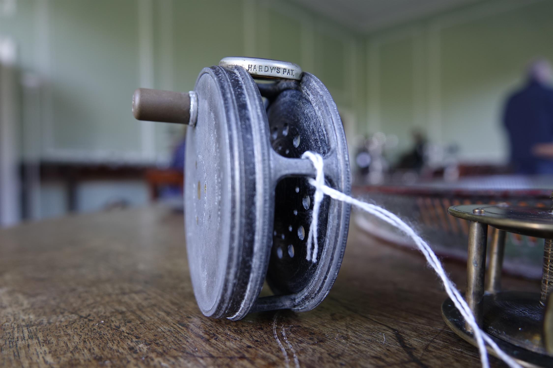 A COLLECTION OF FISHING AND ANGLING RELATED ITEMS, comprising: a Hardy 'Perfect Fly Reel' size - Image 7 of 20