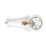 A GOLD MOUNTED MAGNIFYING GLASS 16cm high