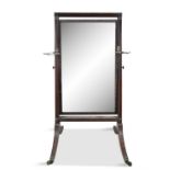 AN IRISH REGENCY CHEVAL MIRROR IN A REEDED FRAME, on outswept legs with square brass sock castors,