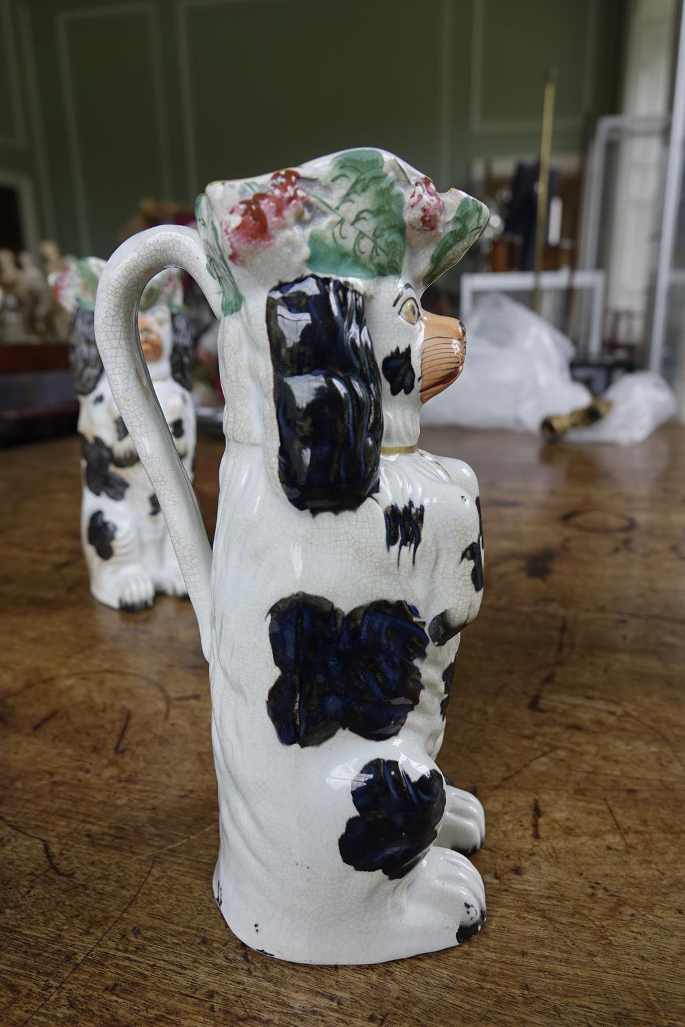 A PAIR OF 19TH CENTURY STAFFORDSHIRE JUGS, moulded in the form of spaniels. 26cm high; Together - Image 5 of 16